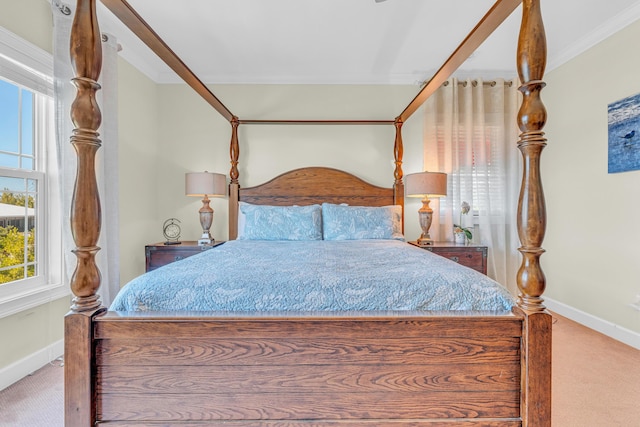 carpeted bedroom featuring crown molding