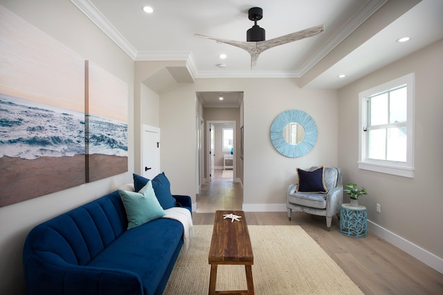 living room with crown molding and wood-type flooring