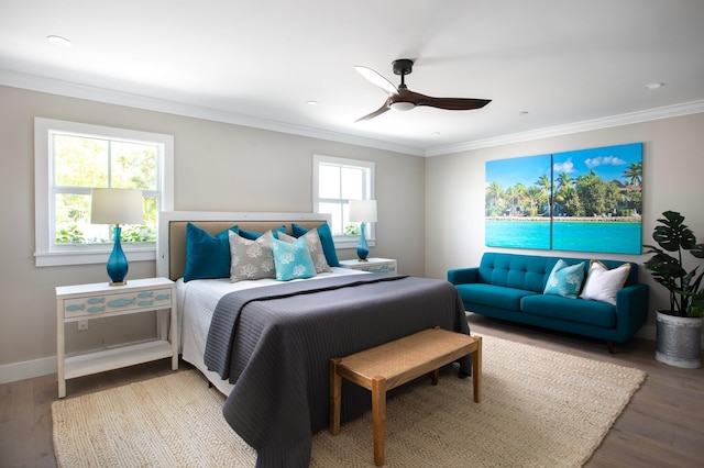 bedroom with crown molding, ceiling fan, and wood-type flooring