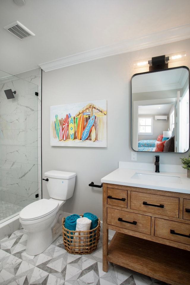 bathroom with vanity, crown molding, and toilet