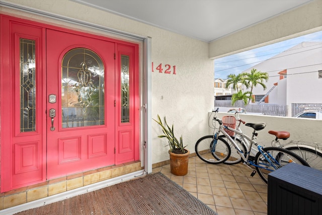 property entrance with stucco siding