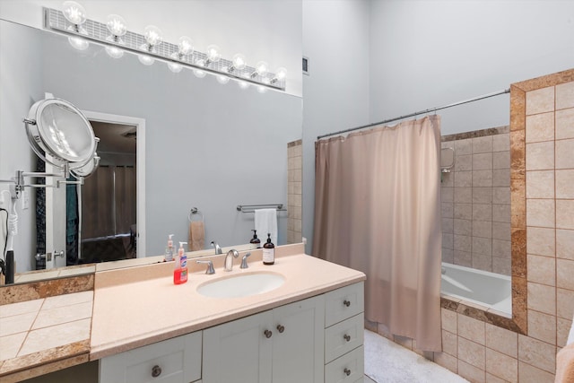 full bathroom with vanity and tiled shower / bath combo