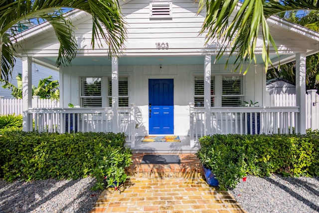 doorway to property with covered porch