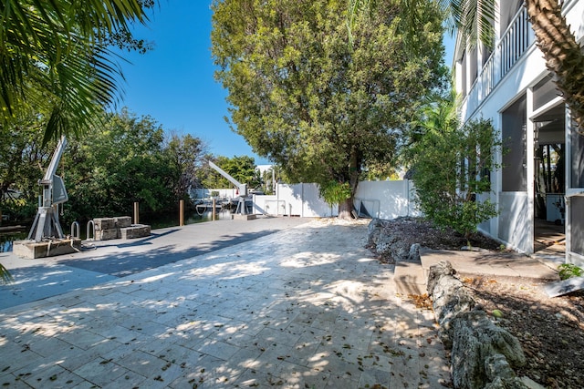 view of yard featuring a patio and fence