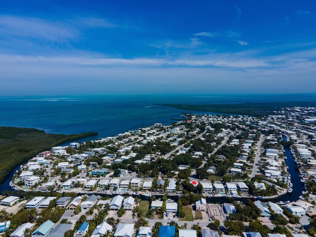 birds eye view of property featuring a residential view and a water view