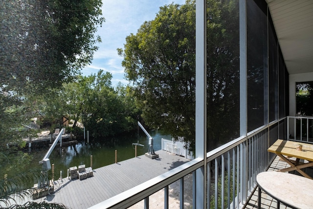 exterior space featuring a boat dock and a water view