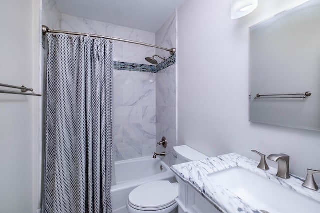 bathroom with vanity, shower / tub combo, and toilet