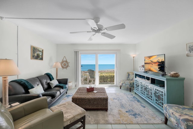 living room with ceiling fan and light tile patterned floors