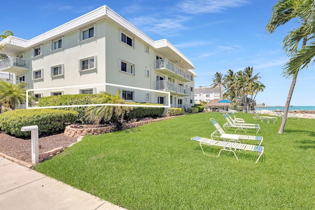 view of building exterior with a water view