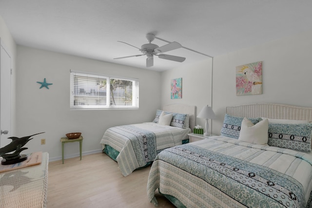 bedroom featuring ceiling fan and light wood-type flooring