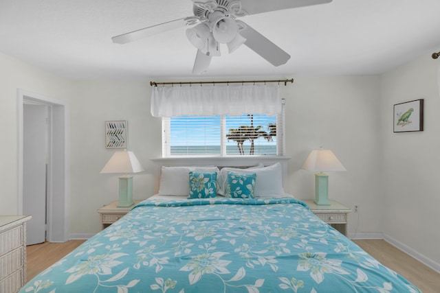 bedroom with ceiling fan and light wood-type flooring