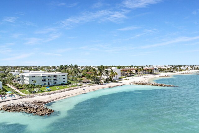 aerial view featuring a water view and a beach view