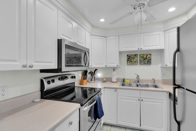 kitchen featuring white cabinetry, sink, and appliances with stainless steel finishes