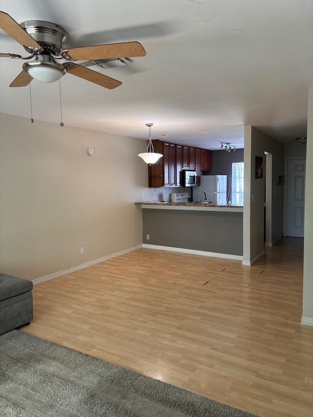 3314 Northside Dr Unit 46, Key West, FL 33040 - unfurnished living room featuring ceiling fan and light wood-type flooring