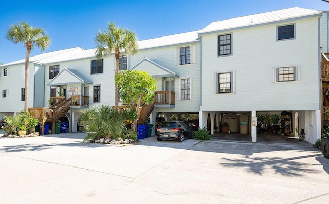 3314 Northside Dr Unit 46, Key West, FL 33040 - view of front of house featuring stairway, a carport, and driveway