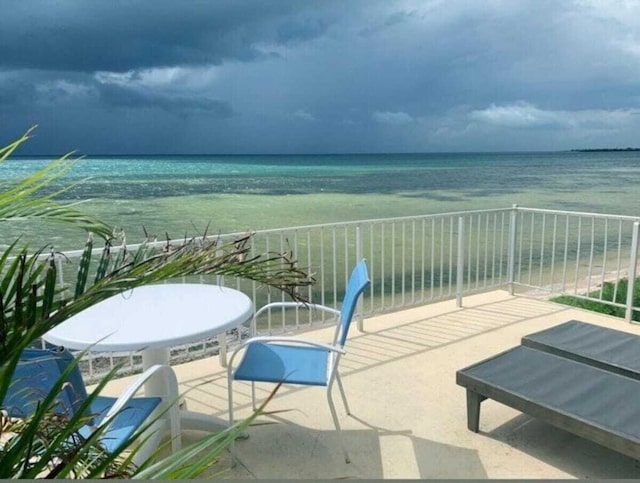 balcony featuring a water view