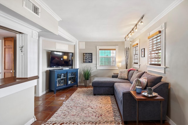 1116 Eaton St, Key West, FL 33040 - living room with ornamental molding, dark tile patterned flooring, and rail lighting