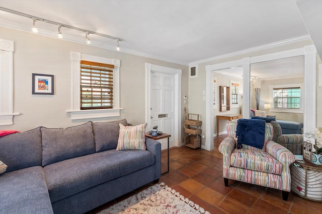 1116 Eaton St, Key West, FL 33040 - living area featuring track lighting, dark tile patterned floors, and ornamental molding