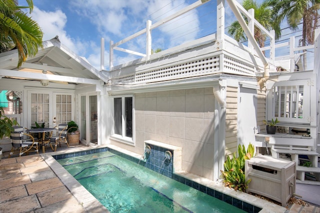 1116 Eaton St, Key West, FL 33040 - back of property featuring a balcony, a pool, french doors, and a patio