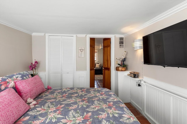 1116 Eaton St, Key West, FL 33040 - bedroom featuring a closet, crown molding, and a wainscoted wall