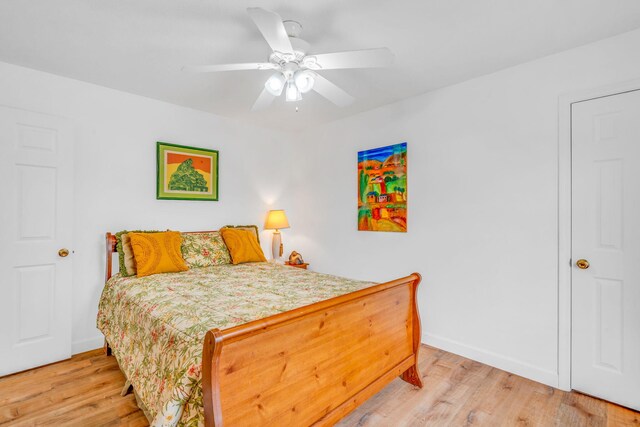 bedroom featuring ceiling fan and light hardwood / wood-style flooring