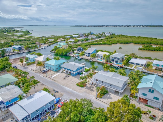 birds eye view of property with a residential view and a water view