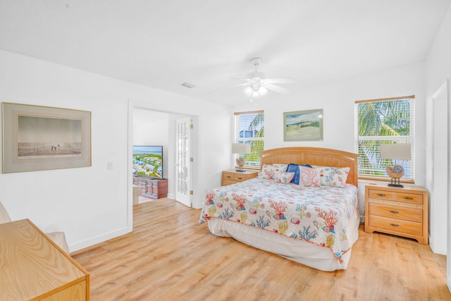 bedroom featuring ceiling fan and light hardwood / wood-style floors