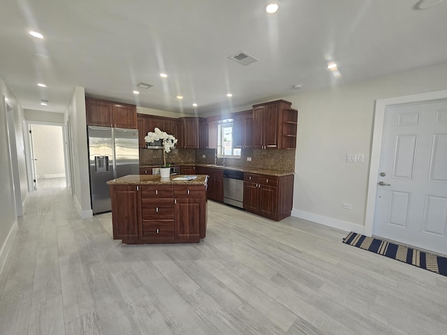 392 Laguna Ave, Key Largo, FL 33037 - kitchen featuring stainless steel appliances, baseboards, a sink, tasteful backsplash, and open shelves