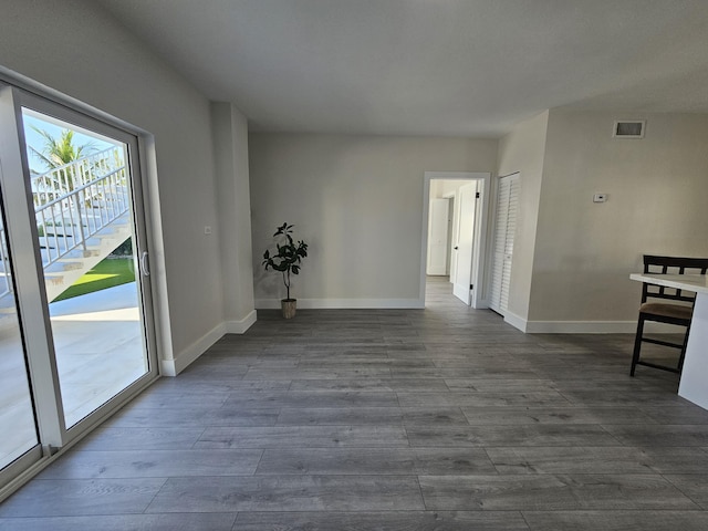 392 Laguna Ave, Key Largo, FL 33037 - empty room featuring baseboards and dark wood-style floors