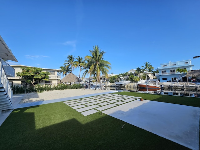 392 Laguna Ave, Key Largo, FL 33037 - view of grassy yard featuring a boat dock and a water view