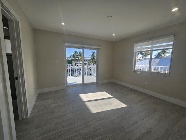 392 Laguna Ave, Key Largo, FL 33037 - empty room featuring wood finished floors, baseboards, and recessed lighting