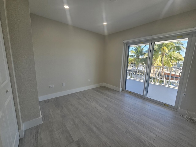 392 Laguna Ave, Key Largo, FL 33037 - spare room with wood finished floors, baseboards, and recessed lighting