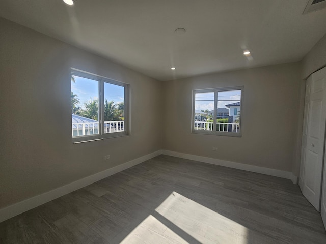 392 Laguna Ave, Key Largo, FL 33037 - unfurnished bedroom featuring baseboards, dark wood-style floors, and recessed lighting