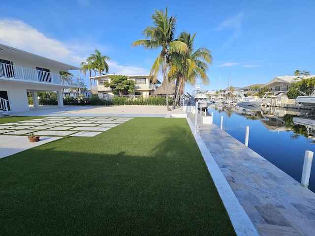 392 Laguna Ave, Key Largo, FL 33037 - view of green lawn with a water view and a dock