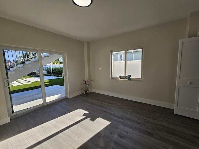 392 Laguna Ave, Key Largo, FL 33037 - empty room with baseboards and dark wood-type flooring