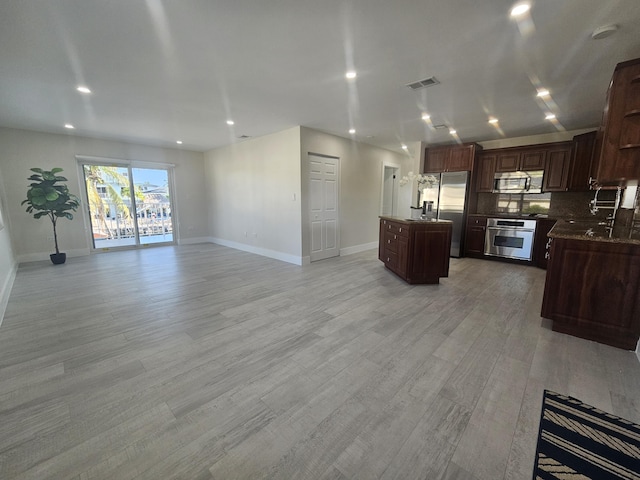 392 Laguna Ave, Key Largo, FL 33037 - kitchen featuring stainless steel appliances, open floor plan, a center island, light wood-type flooring, and recessed lighting
