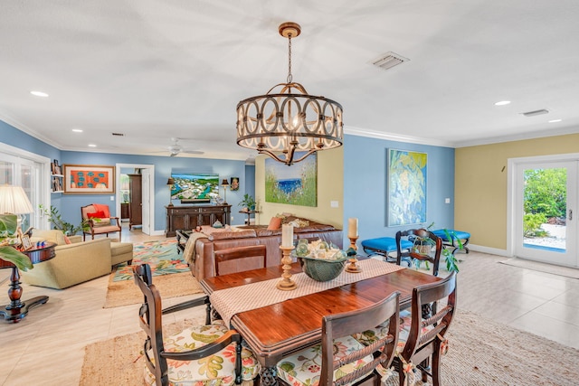 dining area featuring ornamental molding, ceiling fan with notable chandelier, and light tile patterned floors