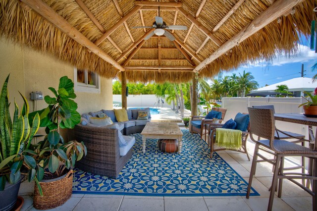 view of patio / terrace with a gazebo, outdoor lounge area, and ceiling fan