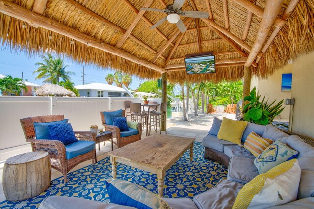 view of patio / terrace with an outdoor living space, a gazebo, and ceiling fan