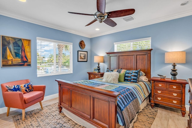 bedroom with ornamental molding and ceiling fan