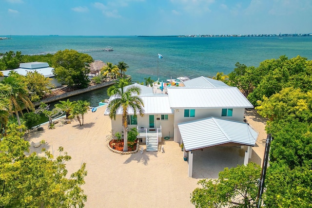 birds eye view of property featuring a water view