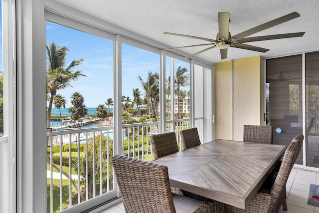 87851 Old Hwy Unit K26, Islamorada, FL 33036 - sunroom / solarium featuring a ceiling fan, a water view, and healthy amount of natural light