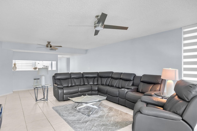 87851 Old Hwy Unit K26, Islamorada, FL 33036 - living area with a ceiling fan, light tile patterned floors, a textured ceiling, and baseboards