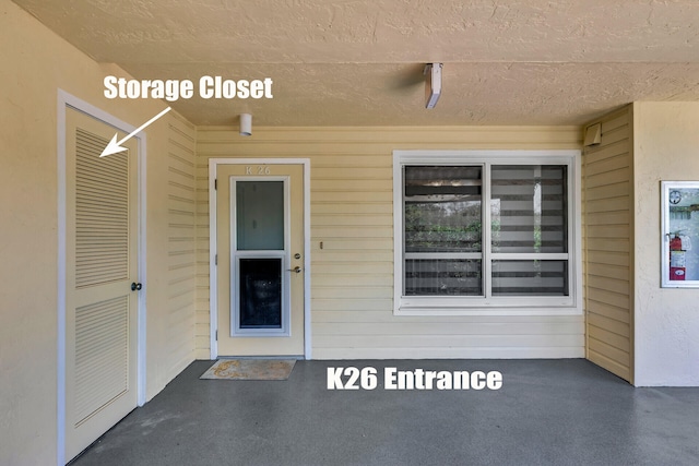 87851 Old Hwy Unit K26, Islamorada, FL 33036 - view of exterior entry with stucco siding