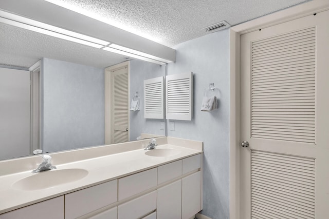 87851 Old Hwy Unit K26, Islamorada, FL 33036 - full bath featuring a textured ceiling, double vanity, and a closet