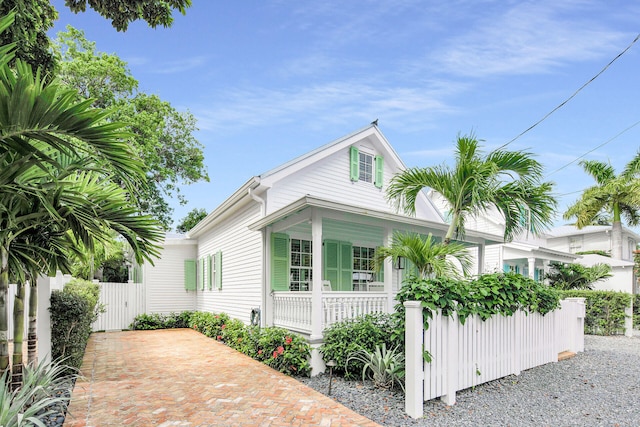 view of side of home featuring a porch