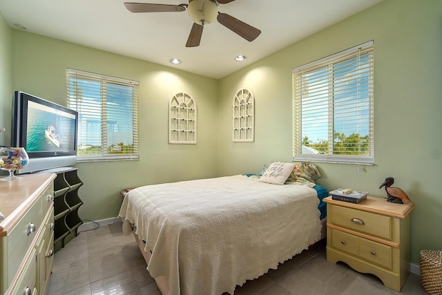 bedroom featuring recessed lighting, ceiling fan, baseboards, and light tile patterned floors