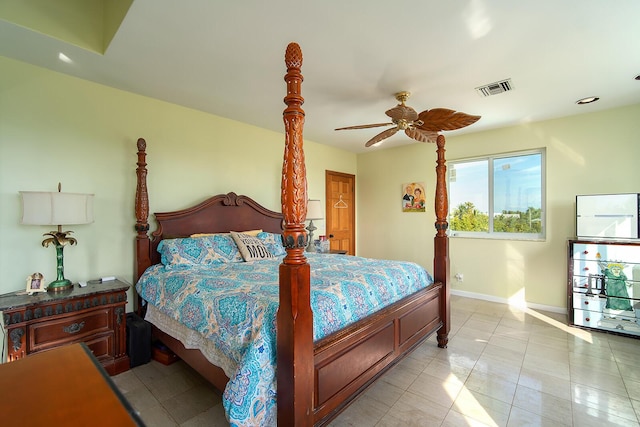 bedroom with light tile patterned floors, a ceiling fan, visible vents, and baseboards