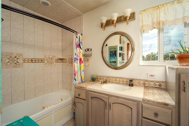 bathroom with a combined bath / shower with jetted tub and vanity