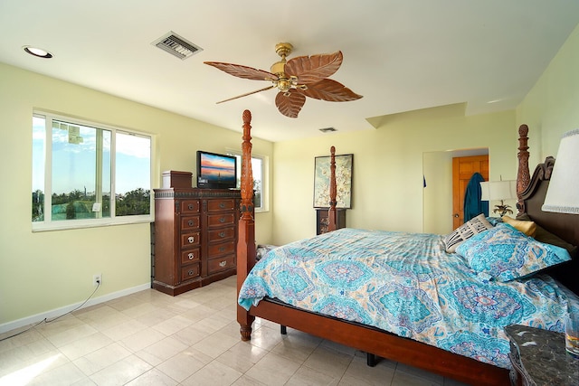 bedroom with light tile patterned floors, baseboards, visible vents, and a ceiling fan